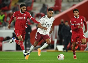 Liverpool v Arsenal 2020-21 Collection: Pierre-Emerick Aubameyang vs. Joe Gomez: A Battle at Anfield in the 2020-21 Premier League