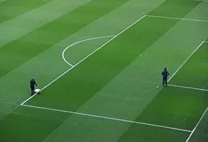 Arsenal v Manchester United 2013-14 Collection: Pitch being marked out pre match. Arsenal 0: 0 Manchester United. Barclays Premier League