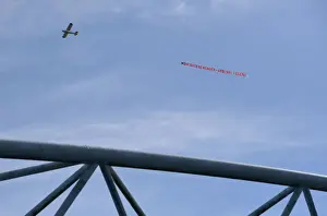 Huddersfield Town V Arsenal 2017-18 Prints: Plane Tows Arsene Wenger Tribute Banner Over Huddersfield Stadium