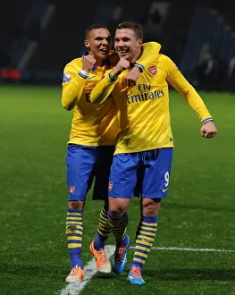 West Ham United V Arsenal 2013-14 Prints: Podolski and Gibbs Celebrate Arsenal's Win over West Ham United