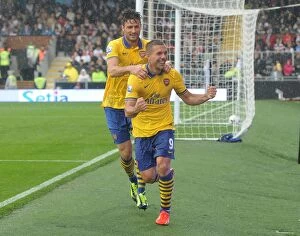 Images Dated 24th August 2013: Podolski and Giroud Celebrate Arsenal's Third Goal vs Fulham (2013-14)