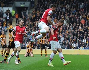 Hull City Collection: Podolski, Giroud, and Ramsey: Celebrating Arsenal's Victory over Hull City (April 2014)