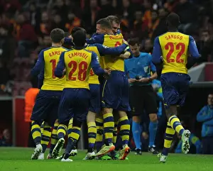 Galatasaray V Arsenal 2014/15 Prints: Podolski and Mertesacker Celebrate Arsenal's First Goal Against Galatasaray in Champions League