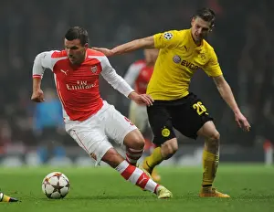 Arsenal V Borussia Dortmund 2014-15 Prints: Podolski Outsmarts Piszczek: Thrilling Showdown between Arsenal and Dortmund in the 2014-15 Champions League