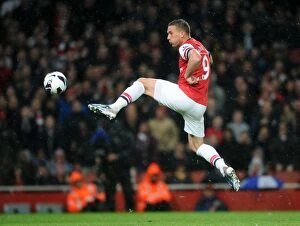 Wigan Athletic Collection: Podolski Scores Arsenal's Third: Arsenal 4-1 Wigan Athletic, Premier League, Emirates Stadium