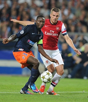 Podolski vs Yanga-Mbiwa: A Champions League Battle