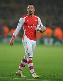 Podolski's Emotional Reaction: Arsenal FC vs Borussia Dortmund, UEFA Champions League (2014-15)