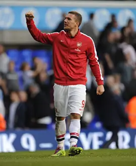 Tottenham Hotspur V Arsenal 2013-14 Prints: Podolski's Euphoria: Arsenal's Thrilling Victory over Tottenham in the Premier League