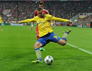 Bayern Munich V Arsenal 2013-14 Prints: Podolski's Return: A Bayern Munich Legend Haunts Old Team in Champions League Showdown - Arsenal vs