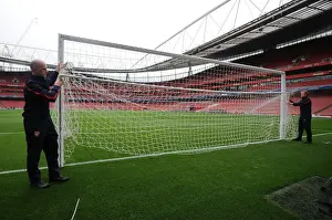 Arsenal V Napoli 2013-14 Prints: Preparing for Battle: Arsenal's North Bank Goal Set for Napoli Clash