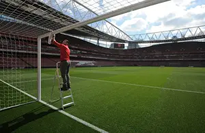 Arsenal V Manchester City 2016-17 Prints: Preparing for the Clash: Arsenal Groundsman Readies Emirates Stadium for Manchester City