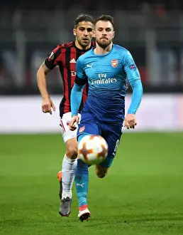 AC Milan V Arsenal 2017-18 Prints: Ramsey Chased by Rodriguez: Intense Moment from AC Milan vs. Arsenal Europa League Clash