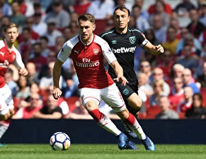 Arsenal v West Ham United 2017-18 Collection: Ramsey Outmaneuvers Noble: Intense Moment from Arsenal vs. West Ham United, Premier League 2017-18