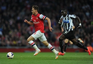 Arsenal V Newcastle United 2013/14 Prints: Ramsey Outpaces Tiote: Intense Rivalry in Arsenal vs