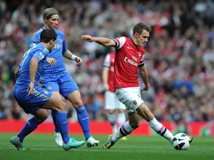 Arsenal V Chelsea 2012-13 Prints: Ramsey Outwits Hazard and Torres: Arsenal's Midfield Maestro Shines in Epic Clash against Chelsea