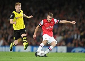 Arsenal v Borussia Dortmund 2013-14 Collection: Ramsey Outwits Reus: Thrilling 2013 Champions League Showdown