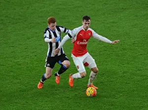 Arsenal V Newcastle United 2015-16 Prints: Ramsey Stands Firm: Arsenal's Midfielder Fends Off Newcastle's Colback in Intense Premier League Clash
