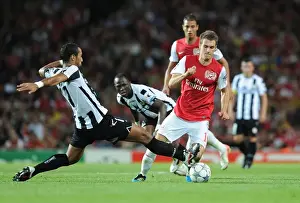 Arsenal V Udinese 2011-12 Prints: Ramsey vs. Benatia: A Champion's Battle in Arsenal's 2011 Champions League Showdown