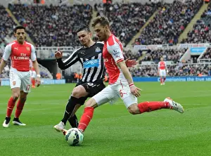 Newcastle United V Arseal 2014/15 Prints: Ramsey vs Cabella: Intense Battle in Newcastle United vs Arsenal Premier League Clash