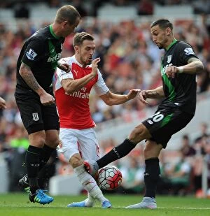 Arsenal v Stoke City 2015-16 Collection: Ramsey vs. Cameron: Intense Face-Off in Arsenal's Clash Against Stoke City