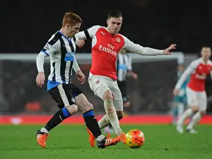 Arsenal V Newcastle United 2015-16 Prints: Ramsey vs. Colback: A Footballing Battle at Emirates Stadium