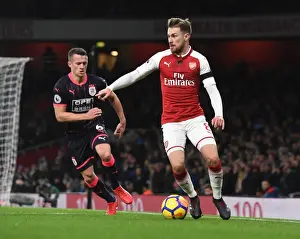 Arsenal V Huddersfield Town 2017-18 Prints: Ramsey vs. Hogg: A Premier League Battle at Emirates Stadium