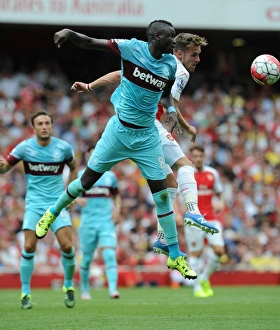 Arsenal V West Ham United 2015-16 Prints: Ramsey vs. Kouyate: A Battle of Midfielders in Arsenal vs. West Ham Premier League Clash