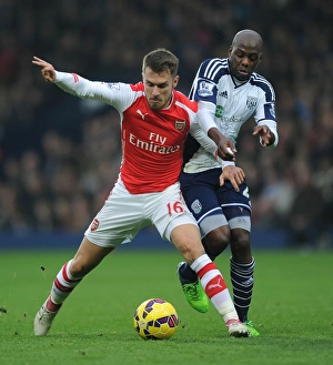 West Bromwich Albion V Arsenal 2014/15 Prints: Ramsey vs. Mulumbu: A Football Battle at The Hawthorns