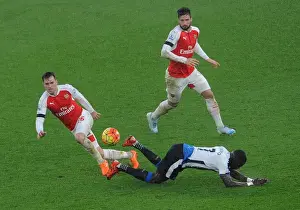 Arsenal V Newcastle United 2015-16 Prints: Ramsey vs Sissoko: A Premier League Showdown - Arsenal's Battle with Newcastle's Midfielders