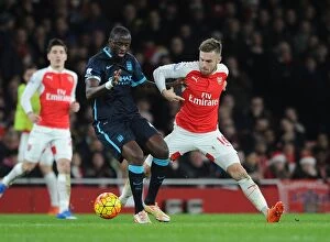 Arsenal v Manchester City 2015-16 Collection: Ramsey vs Toure: Clash of the Titans in Arsenal vs Manchester City (2015-16)
