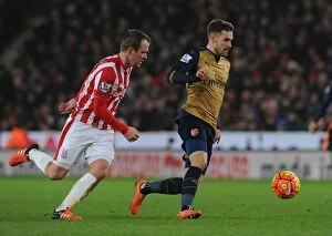 Stoke City v Arsenal 2015-16 Collection: Ramsey vs. Whelan: A Footballing Battle at Stoke City (2015-16)