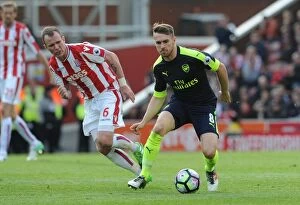 Images Dated 13th May 2017: Ramsey vs. Whelan: Intense Battle in Stoke City vs. Arsenal Premier League Clash