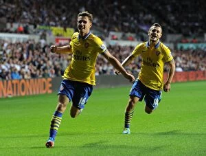 Swansea City v Arsenal 2013-14 Collection: Ramsey and Wilshere: Celebrating Arsenal's Victory at Swansea (2013-14)