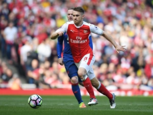 Arsenal V Manchester United 2016-17 Prints: Ramsey's Brilliant Outmaneuver: Arsenal's Star Outsmarts Rooney in Thrilling Premier League Clash (2016-17)