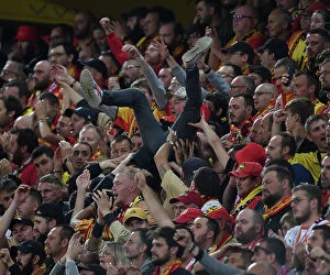 RC Lens v Arsenal 2023-24 Collection: RC Lens vs. Arsenal: Thrilling Champions League Clash with Fan Surfing Euphoria