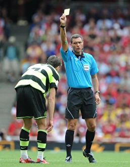 Referee Andre marriner shows a yellow card to Charlie Mulgrew (Celtic) Referee Andre marriner shows a yellow card to Charlie Mulgrew (Celtic)
