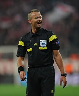 Images Dated 11th March 2014: Referee Svein Oddvar Moen Overssees Tense Bayern Munich vs. Arsenal UEFA Champions League Clash
