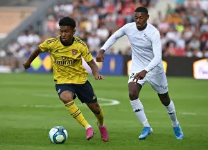 Angers SCO V Arsenal 2019-20 Prints: Reiss Nelson Faces Off Against Jeff Reine-Adelaide in Angers vs Arsenal Pre-Season Clash