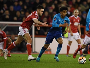 Nottingham Forest V Arsenal FA Cup 3rd Round 2017-18 Prints: Reiss Nelson Outmaneuvers Ben Brereton: Nottingham Forest vs Arsenal - FA Cup Third Round