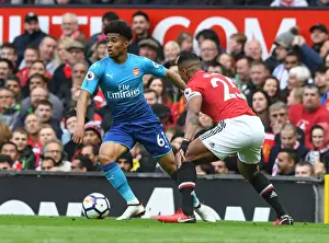 Manchester United V Arsenal 2017-18 Prints: Reiss Nelson vs. Antonio Valencia: A Premier League Showdown at Old Trafford