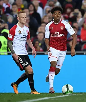 Sydney Western Wanderers V Arsenal 2017-18 Prints: Reiss Nelson vs Jack Clisby: Battle on the Soccer Field between Western Sydney Wanderers and Arsenal FC