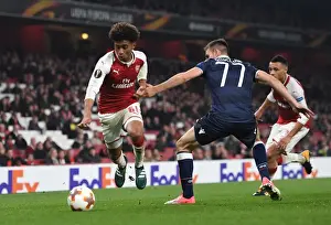 Arsenal V Red Star Belgrade 2017-18 Prints: Reiss Nelson vs Marko Gobeljic: Battle at Emirates Stadium - Arsenal FC vs Crvena Zvezda
