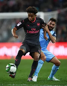 Sydney FC V Arsenal - 2017-18 Prints: Reiss Nelson vs Michael Zullo: A Battle in the Pre-Season Friendly Between Sydney FC and Arsenal