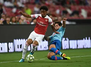 Arsenal V Atletico Madrid 2018-19 Prints: Reiss Nelson vs Mikel Carro: Clash between Arsenal and Atletico Madrid at the International Champions Cup 2018