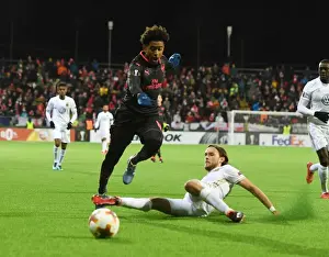 Ostersunds V Arsenal 2017-18 Prints: Reiss Nelson vs Tom Pettersson: Battle in the Europa League between Ostersunds and Arsenal