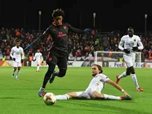 Ostersunds V Arsenal 2017-18 Prints: Reiss Nelson vs Tom Pettersson: Clash in the Europa League between Ostersunds and Arsenal