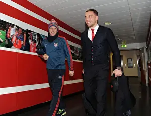 Arsenal V Bayern Munich 2013-14 Prints: A Reunion on the Field: Podolski and Schweinsteiger Before the Arsenal-Bayern UEFA Champions League Clash