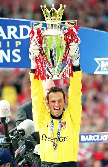 Richard Wright lifts the F. A. Barclaycard Premiership Trophy
