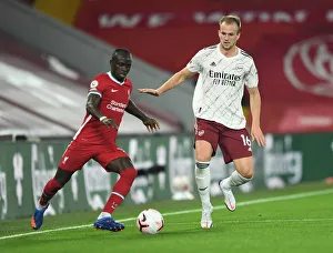 Rivalry Restarted: Holding Holds Off Mane in Empty Anfield