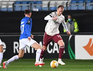 Molde FK V Arsenal 2020-21 Prints: Rob Holding in Action: Arsenal's Europa League Battle against Molde FK